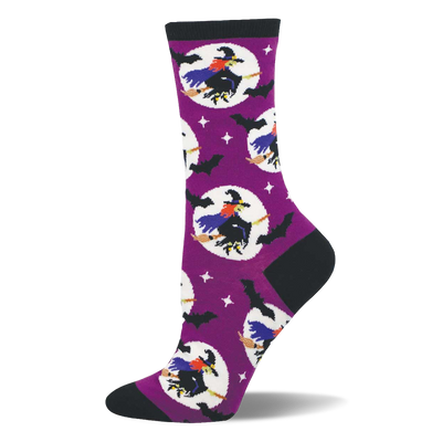 Purple crew sock with black cuff, heel, toe. Features flying witches on brooms in white moons, black bats, and white stars.