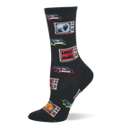 Black crew socks with retro TVs showing 'HORROR', spooky hands, and jack-o'-lanterns, plus VHS tapes with red and green splatters.