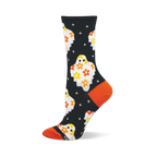 Black crew sock with white flower ghosts, yellow eyes, orange and yellow flowers on body, white cross shapes, and orange heel/toe.