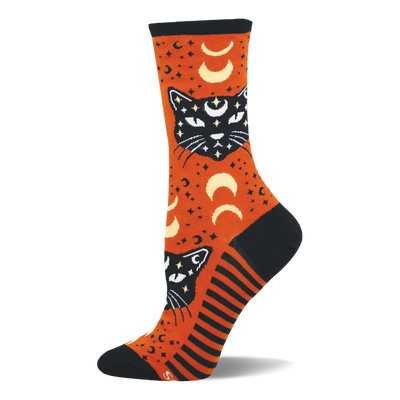 Orange crew sock with black mystic cats, white eyes, crescent moons, and stars. Features black toe, heel, cuff, and striped side panel.