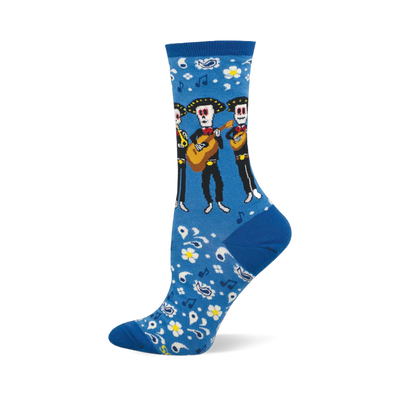 Bright blue crew socks with a pattern of skeleton mariachi musicians, guitars, white flowers, paisley, and music notes.