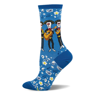 Bright blue crew socks with a pattern of skeleton mariachi musicians, guitars, white flowers, paisley, and music notes.