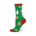 Green crew sock with red toe, heel, and cuff, featuring a pattern of milk, chocolate chip cookies, gingerbread man and house, and candy canes.