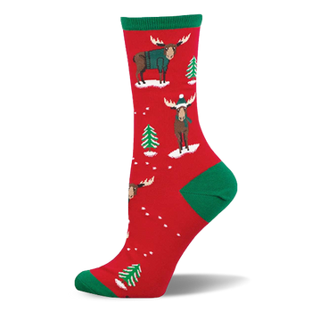 Red crew socks with green accents, featuring festive moose in teal sweaters and beanies, plus green Christmas trees and white snow.