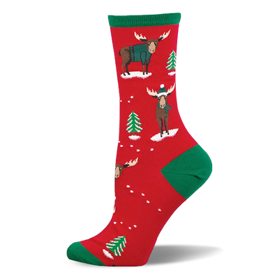 Red crew socks with green accents, featuring festive moose in teal sweaters and beanies, plus green Christmas trees and white snow.