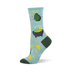 Light blue crew sock with an angelic green avocado, guacamole in a molcajete, yellow stars, and tortilla chips. Dark green heel and toe.