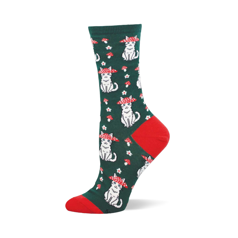 Green crew sock with red heel and toe. The pattern shows white sitting cats wearing red and white mushroom caps as hats.