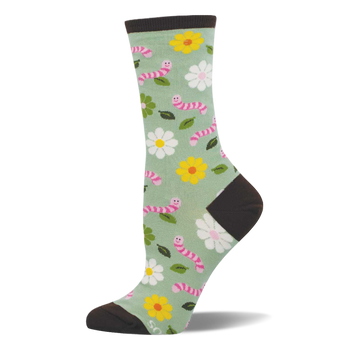 Light green crew socks with pink smiling worms, white and yellow flowers, and green leaves. Dark brown heel, toe, and cuff.