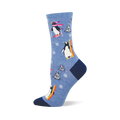 Light blue crew sock with skiing and snowboarding penguins, white snowflakes, and snow-covered pine trees. Dark blue heel and toe.