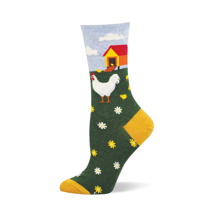 Crew sock with a farm scene: white hen, yellow chicks, red and yellow chicken coop, green field with flowers, blue sky, mustard yellow heel and toe. }}