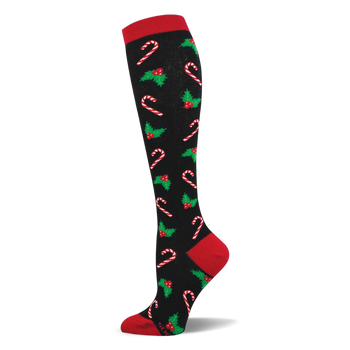 Black knee-high sock with red cuff, heel, and toe. Repeating pattern of white/red candy canes, green holly, red berries.