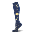 Knee-high sock in dark navy blue with an all-over pattern of golden suns, crescent moons, and stars with orbital rings.