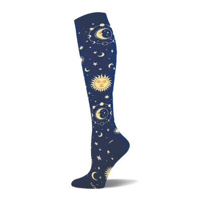 Knee-high sock in dark navy blue with an all-over pattern of golden suns, crescent moons, and stars with orbital rings.