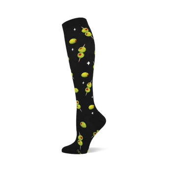 Black knee-high sock with a repeating pattern of green cocktail olives with red pimentos on skewers and white starbursts.