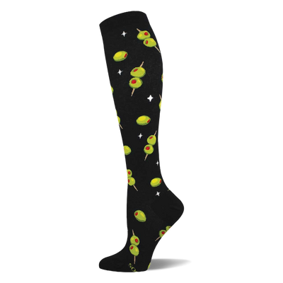 Black knee-high sock with a repeating pattern of green cocktail olives with red pimentos on skewers and white starbursts.