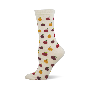 Cream crew socks with a repeating pattern of red, dark red, and yellow pixelated apples, each with a green stem.