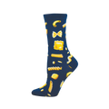 Single crew sock on a foot. Dark blue sock with a pattern of various golden yellow pasta shapes like farfalle, ravioli, and fusilli.