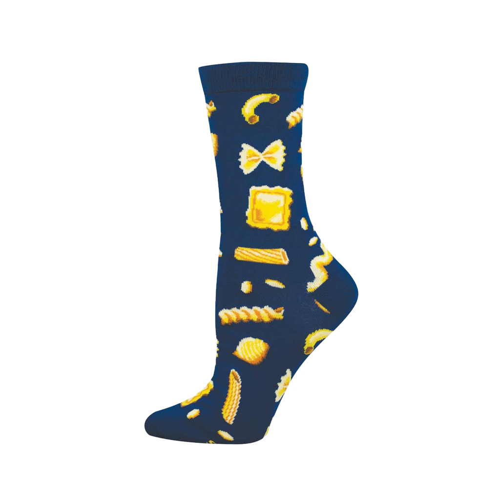 Single crew sock on a foot. Dark blue sock with a pattern of various golden yellow pasta shapes like farfalle, ravioli, and fusilli.