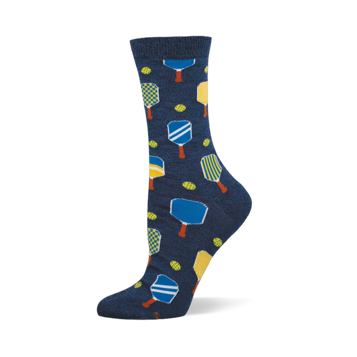 Navy blue crew socks with a repeating pattern of yellow, blue, and white pickleball paddles and yellow-green pickleballs. }}