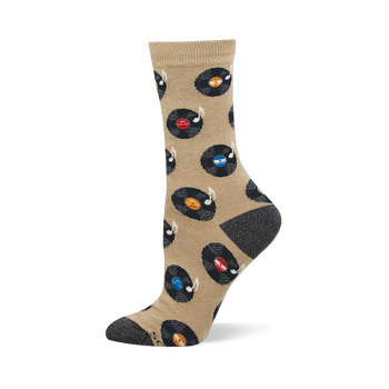 A single tan crew sock with a pattern of black vinyl records, colorful labels, and white music notes. Dark grey heel and toe.