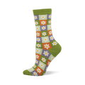 Side view of a crew sock with a checkerboard of light green, orange, and purple squares, each with a white daisy. Dark green cuff, heel, and toe.