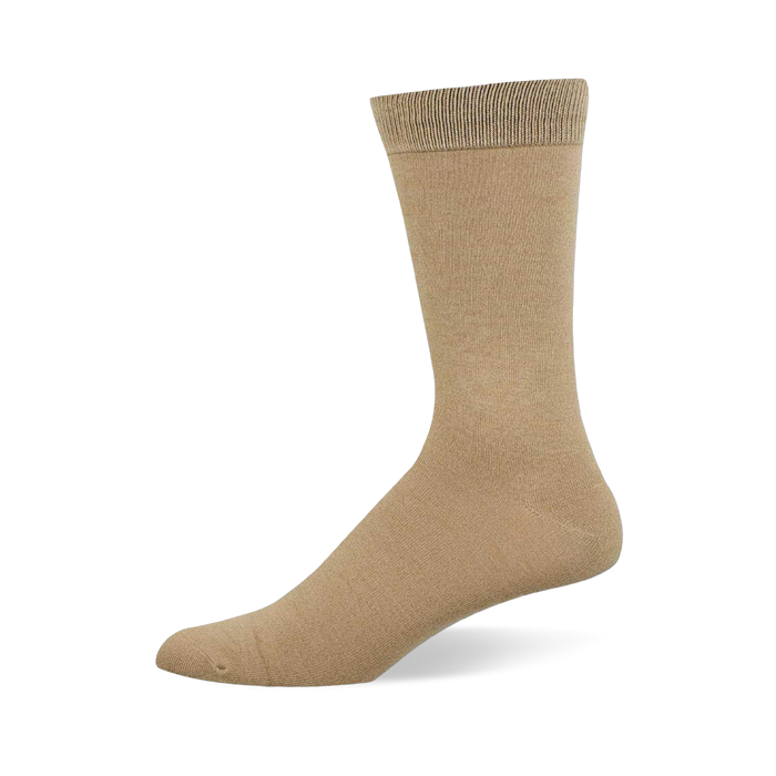 A single solid tan crew sock stands upright on a white background, viewed from the side, showing the toe, heel, and ribbed cuff.