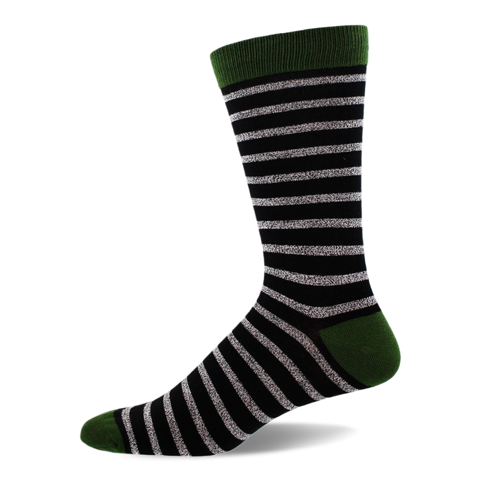 Single crew sock with black background and shimmering silver horizontal stripes, solid dark green cuff, heel, and toe.