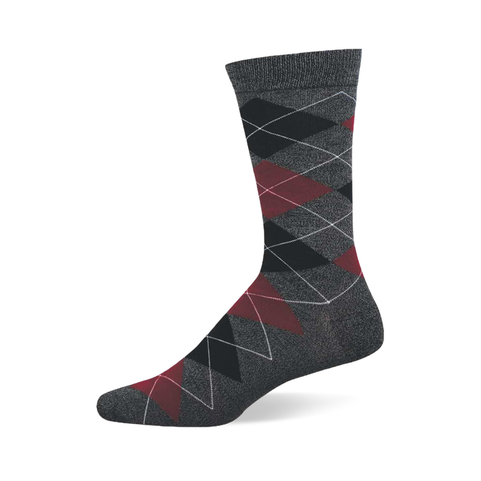 A single dark grey crew sock with a prominent argyle pattern of black, dark red, and grey diamonds.