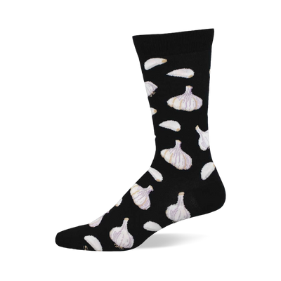 A black crew sock with a repeating pattern of white and subtly purple-veined garlic bulbs and scattered white garlic cloves.