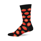 Black crew sock with a repeating pattern of red whole and half-sliced tomatoes showing green stems and yellow seeds.