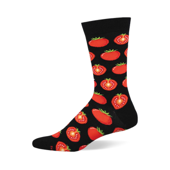 Black crew sock with a repeating pattern of red whole and half-sliced tomatoes showing green stems and yellow seeds.