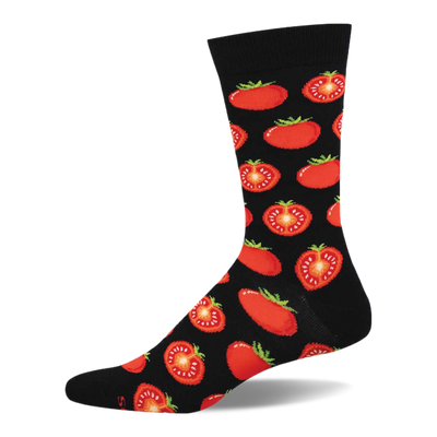 Black crew sock with a repeating pattern of red whole and half-sliced tomatoes showing green stems and yellow seeds.