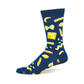 A single dark blue crew sock with a repeating pattern of yellow pasta shapes, including macaroni, bow-ties, penne, and ravioli.