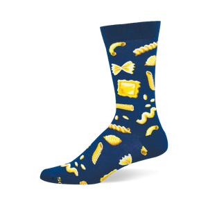 A single dark blue crew sock with a repeating pattern of yellow pasta shapes, including macaroni, bow-ties, penne, and ravioli.