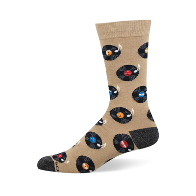 Tan crew sock with black vinyl records, colorful labels (red, blue, orange, light blue), and white music notes. Dark grey heel and toe.
