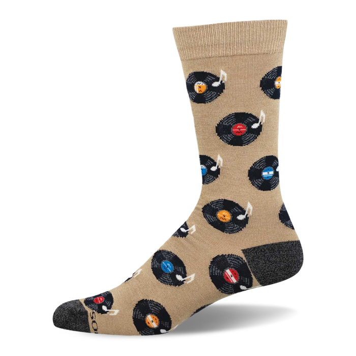 Tan crew sock with black vinyl records, colorful labels (red, blue, orange, light blue), and white music notes. Dark grey heel and toe. }}