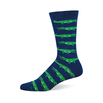 A single mid-calf sock with a navy blue base and repeating pattern of bright green alligators with open mouths and white teeth.