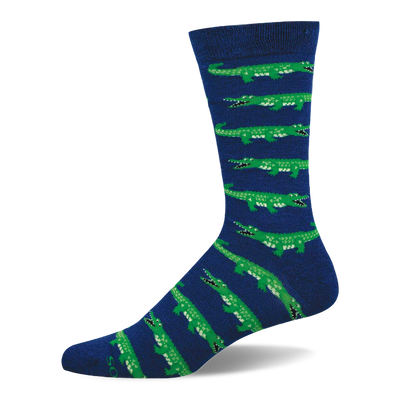 A single mid-calf sock with a navy blue base and repeating pattern of bright green alligators with open mouths and white teeth.