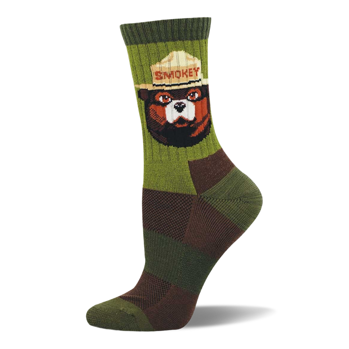 Crew sock with a Smokey Bear portrait on ribbed olive-green. Lower sock has dark green and brown checkerboard pattern. }}