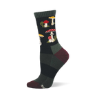 Single dark crew sock with a repeating pattern of red and white spotted mushrooms, yellow-capped mushrooms, and green foliage. Dark green cuff, burgundy heel and toe.