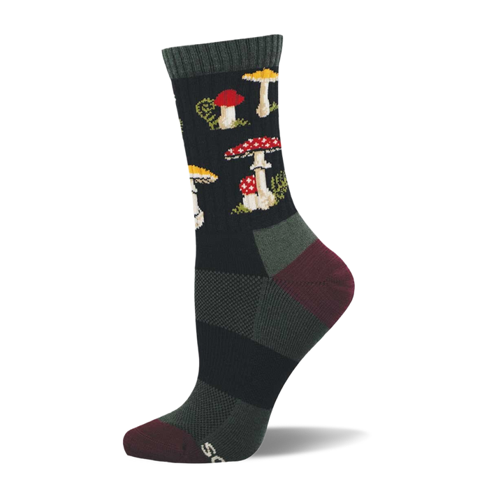 Single dark crew sock with a repeating pattern of red and white spotted mushrooms, yellow-capped mushrooms, and green foliage. Dark green cuff, burgundy heel and toe. }}