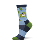 Crew sock with light blue leg, green frog, green leaves. Dark blue cuff, heel, and toe with light blue and lime green color blocks.
