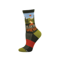 Dark green crew sock with a scenic mountain view, pine trees, blue sky, orange sun, and 'ENJOY THE VIEW' text.