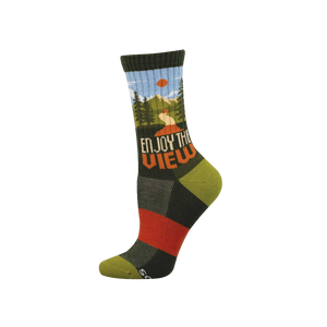 Dark green crew sock with a scenic mountain view, pine trees, blue sky, orange sun, and 'ENJOY THE VIEW' text.