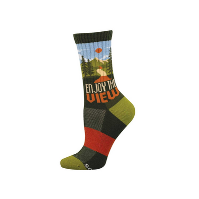 Dark green crew sock with a scenic mountain view, pine trees, blue sky, orange sun, and 'ENJOY THE VIEW' text.