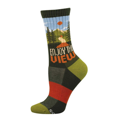 Dark green crew sock with a scenic mountain view, pine trees, blue sky, orange sun, and 'ENJOY THE VIEW' text.