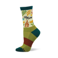Crew sock with "Stay Wild" text, green and orange leaves, yellow flowers on a cream background. Teal cuff, heel, toe. Green/brown stripes.