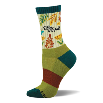 Crew sock with "Stay Wild" text, green and orange leaves, yellow flowers on a cream background. Teal cuff, heel, toe. Green/brown stripes.