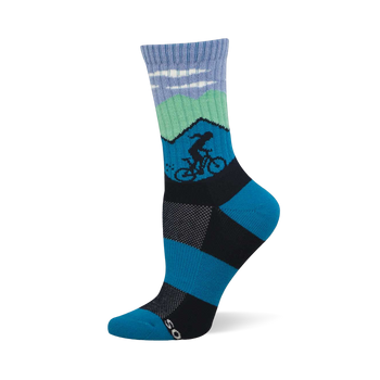 Blue and green crew sock with mountain scene, white clouds, and a dark silhouette of a cyclist. Blue and black checkerboard foot design.