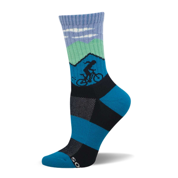 Blue and green crew sock with mountain scene, white clouds, and a dark silhouette of a cyclist. Blue and black checkerboard foot design.